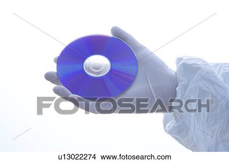 Picture - Hand in latex glove holding disc . Fotosearch