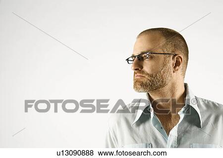 Head and shoulder portrait of man looking to side against white background. View Large Photo Image Stock Photo - Head and shoulder portrait of man looking to side against white background.. Fotosearch