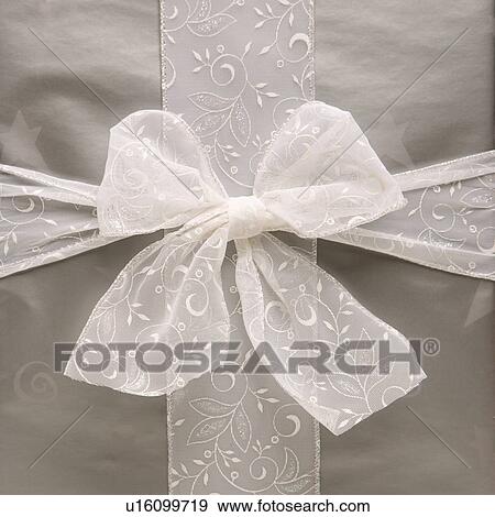 large silver wrapped gift with bow View Large Photo Image Stock Photo - large silver wrapped gift with bow. Fotosearch