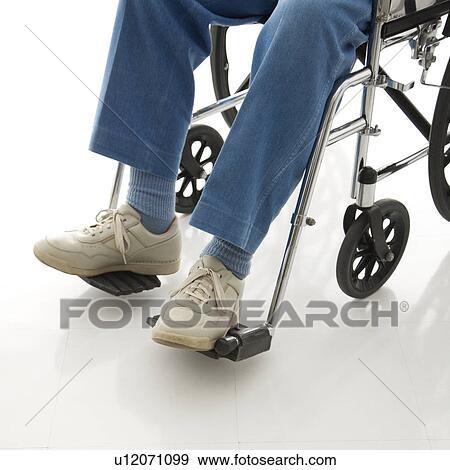 Legs and feet of elderly man sitting in wheelchair. View Large Photo Image Stock Photo - Legs and feet of elderly man sitting in wheelchair.. Fotosearch