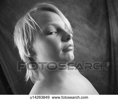 Male adolescent looking at viewer out of corner of eye View Large Photo Image Stock Photo - Male adolescent looking at viewer out of corner of eye. Fotosearch