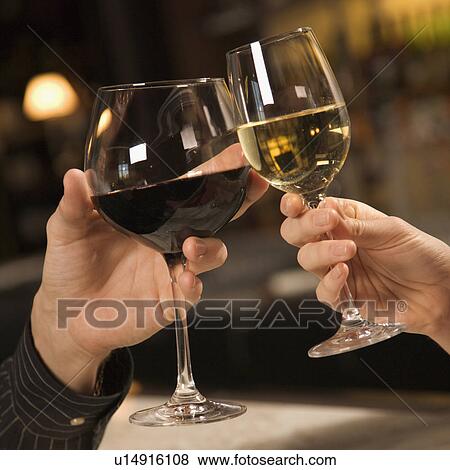 male and female hands toasting wine glasses View Large Photo Image Stock Photo - male and female hands toasting wine glasses. Fotosearch