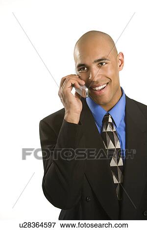 Stock Photo - Man in suit talking on cellphone. Fotosearch