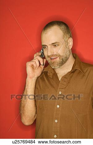 Picture - Man talking on cellphone. Fotosearch