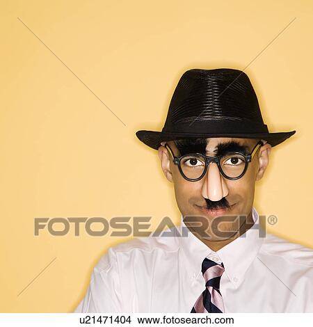 Man wearing groucho mask disguise View Large Photo Image Picture - Man wearing groucho mask disguise. Fotosearch
