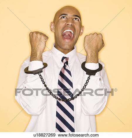 Man wearing handcuffs and screaming View Large Photo Image Stock Photo - Man wearing handcuffs and screaming. Fotosearch