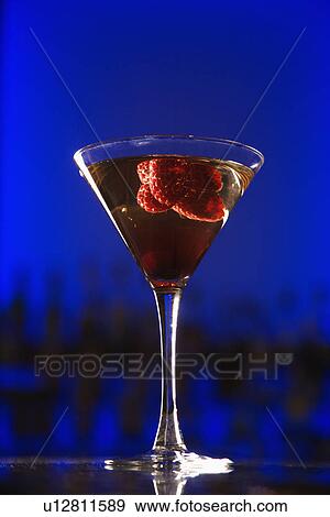 Martini cocktail with raspberry fruit View Large Photo Image Stock Photo - Martini cocktail with raspberry fruit . Fotosearch