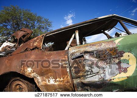 Old abandoned and rusted car View Large Photo Image Stock Photo - Old abandoned and rusted car. Fotosearch