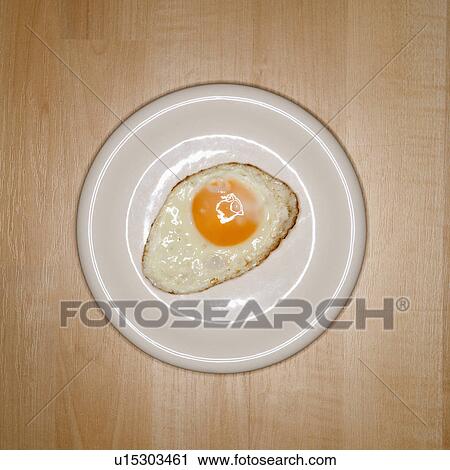 Stock Image - One fried egg on plate. Fotosearch
