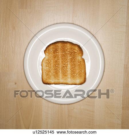 Stock Photography - One slice of toast on plate. Fotosearch