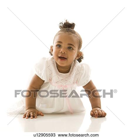 Stock Image - Portrait of African American infant girl against white background.. Fotosearch
