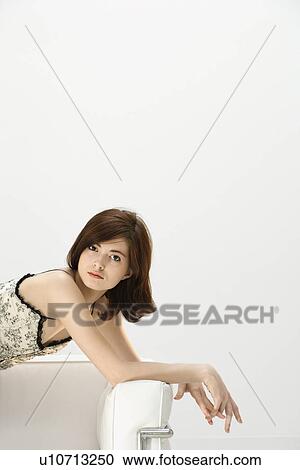 Stock Image - Portrait of attractive young redhead woman.. Fotosearch