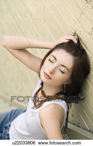 Portrait of attractive young redhead woman sitting on steps View Large Photo Image Stock Photograph - Portrait of attractive young redhead woman sitting on steps. Fotosearch