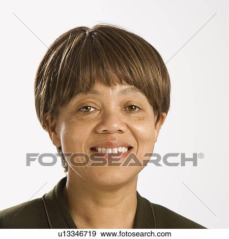 Portrait of smiling mid adult female View Large Photo Image Stock Photo - Portrait of smiling mid adult female. Fotosearch