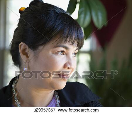 Portrait of woman looking to the side View Large Photo Image Stock Photo - Portrait of woman looking to the side. Fotosearch
