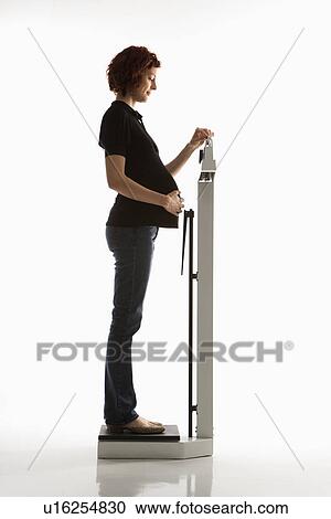 Pregnant woman reading scale View Large Photo Image Stock Image - Pregnant woman reading scale. Fotosearch