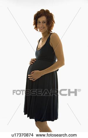 pregnant woman standing with hands on belly View Large Photo Image Picture - pregnant woman standing with hands on belly. Fotosearch