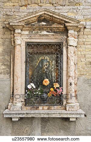 Religious shrine on exterior of building in Venice, Italy View Large Photo Image Stock Image - Religious shrine on exterior of building in Venice, Italy. Fotosearch