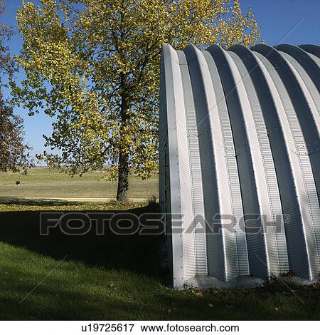 Side view of steel hay storage building on farm View Large Photo Image Stock Photo - Side view of steel hay storage building on farm. Fotosearch