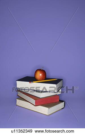 Stack of books with apple and pencil. View Large Photo Image Stock Photo - Stack of books with apple and pencil.. Fotosearch