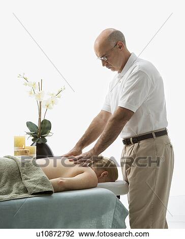Stock Image - Therapist massaging back . Fotosearch