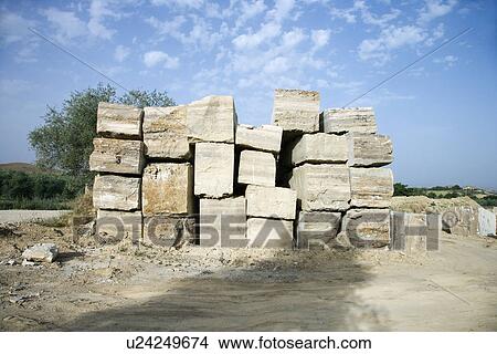 Picture - Travertine stone excavated from open mine quarry. Fotosearch