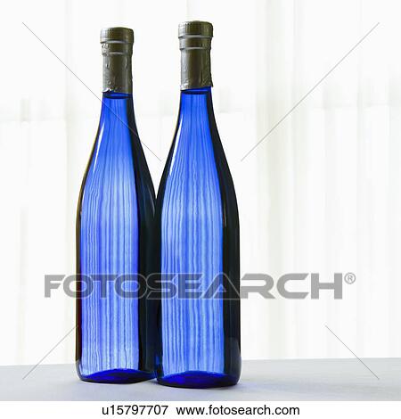 Stock Photo - Two blue bottles with on white. Fotosearch