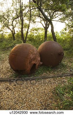 Stock Image - Two rusty metal balls.. Fotosearch