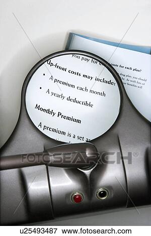 Vision magnifying glass used to view health insurance information View Large Photo Image Stock Photo - Vision magnifying glass used to view health insurance information. Fotosearch