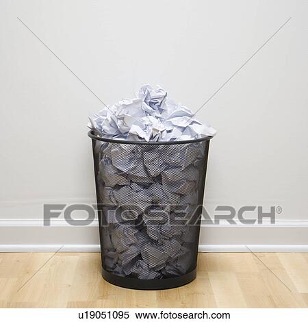 Wire mesh trash can filled with crumpled paper View Large Photo Image Stock Photography - Wire mesh trash can filled with crumpled paper. Fotosearch