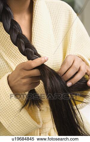 Woman braiding hair View Large Photo Image Stock Photography - Woman braiding hair. Fotosearch