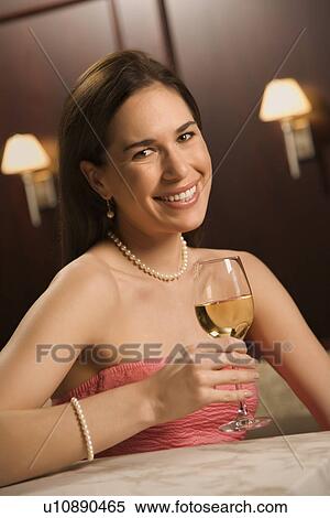 Woman in dress holding glass of wine View Large Photo Image Stock Photography - Woman in dress holding glass of wine. Fotosearch