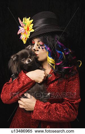 Woman kissing black Pomeranian dog View Large Photo Image Stock Photography - Woman kissing black Pomeranian dog . Fotosearch