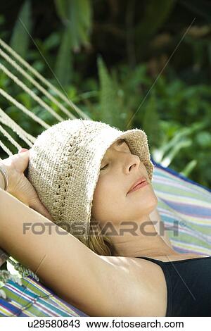 Woman napping in hammock View Large Photo Image Stock Image - Woman napping in hammock. Fotosearch