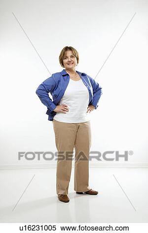 Stock Photography - Woman standing with hands on hips . Fotosearch