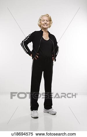 Stock Photography - Woman standing with hands on hips . Fotosearch