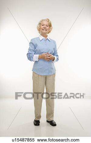 Stock Photography - Woman standing with hands together . Fotosearch