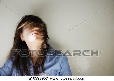 Woman swinging head and hair around View Large Photo Image Stock Photo - Woman swinging head and hair around. Fotosearch