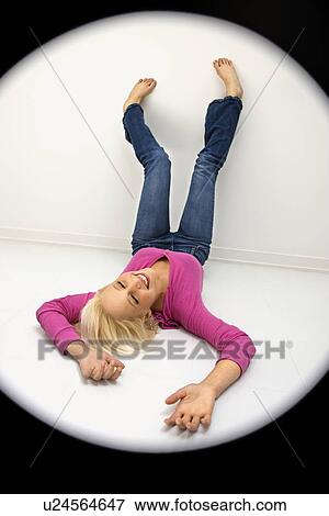 Stock Photo - Woman wearing fuchsia lying . Fotosearch