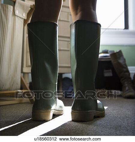 Woman's legs wearing green rubber boots View Large Photo Image Stock Image - Woman's legs wearing green rubber boots. Fotosearch