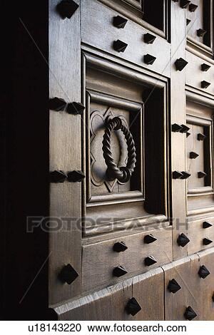 Wooden door with metal spikes and knocker View Large Photo Image Stock Image - Wooden door with metal spikes and knocker. Fotosearch