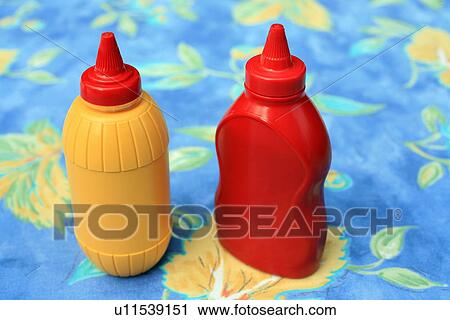 Stock Image - Bottles of ketchup and mustard. Fotosearch