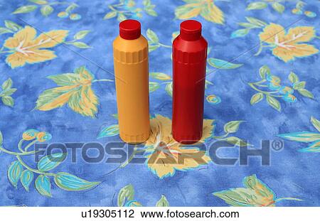 Stock Image - Bottles of ketchup and mustard. Fotosearch