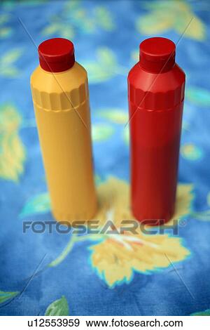 Stock Photo - Bottles of ketchup and mustard. Fotosearch