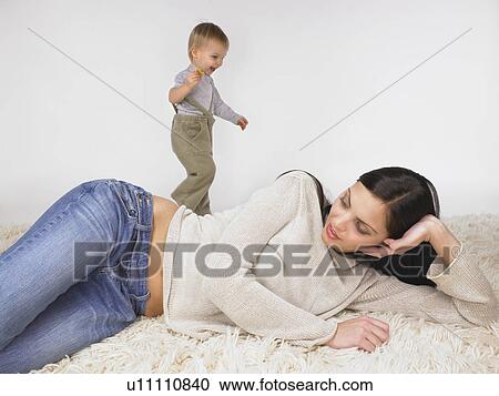 Stock Image - Daughter and mother playing.. Fotosearch