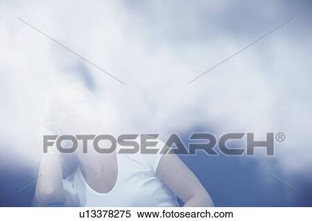 Young woman using mobile phone with reflections of clouds. View Large Photo Image Stock Photography - Young woman using mobile phone with reflections of clouds.. Fotosearch
