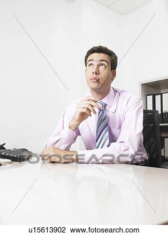 Businessman in an office View Large Photo Image Stock Image - Businessman in an office. Fotosearch