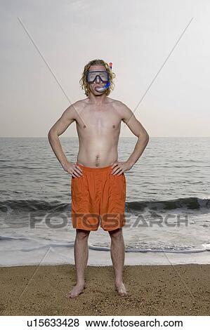Stock Photo - Man wearing mask on beach.. Fotosearch