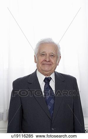 Senior man in suit, smiling, portrait View Large Photo Image Stock Photography - Senior man in suit, smiling, portrait. Fotosearch