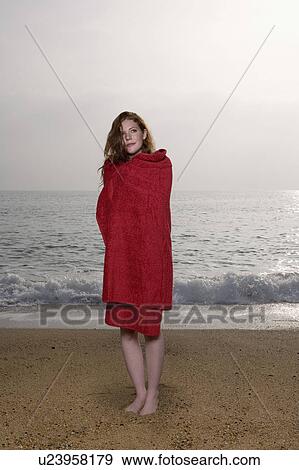 Woman with a towel on the beach. View Large Photo Image Stock Photo - Woman with a towel on the beach.. Fotosearch